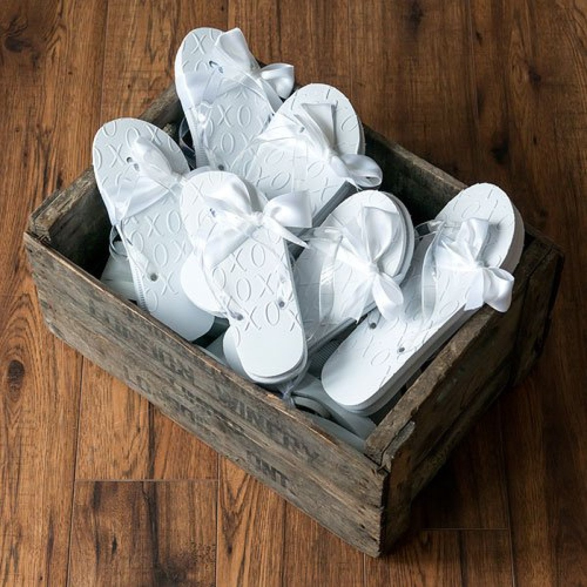 White XO Embossed Flip Flops